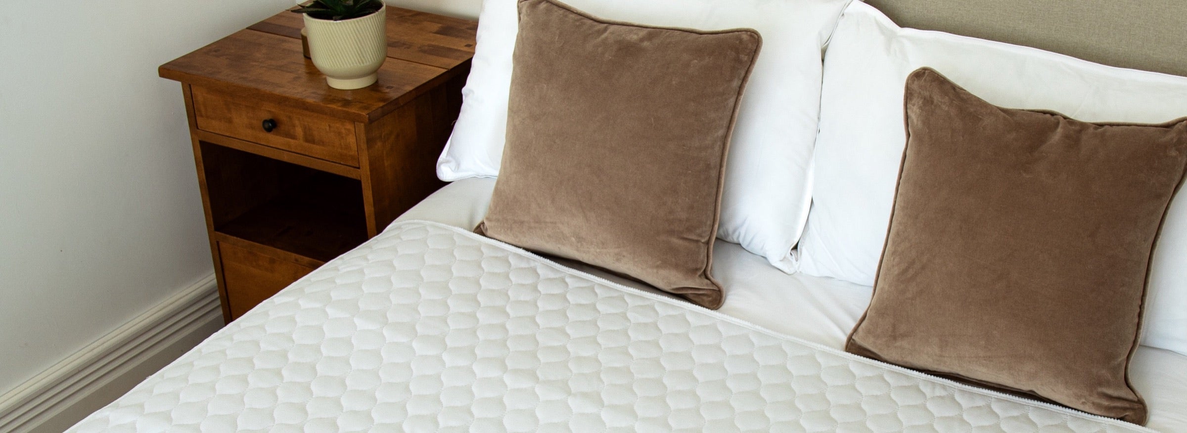 Quilted Bedwetz mattress protector on a bed