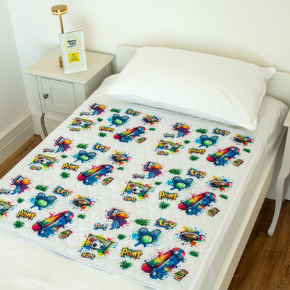 Bedwetz Graffiti waterproof mattress protector on a single bed with the Mother&Baby Awards 2026 Gold trophy