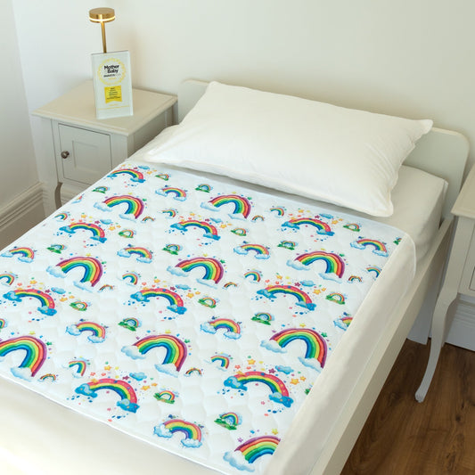 Bedwetz Rainbow waterproof mattress protector on a single bed with the Mother&Baby Awards 2026 Gold trophy