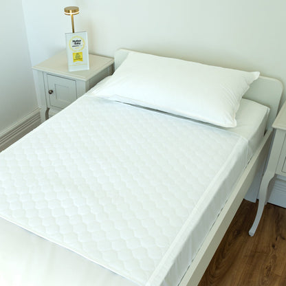Bedwetz White Plain waterproof mattress protector on a single bed with the Mother&Baby Awards 2026 Gold trophy