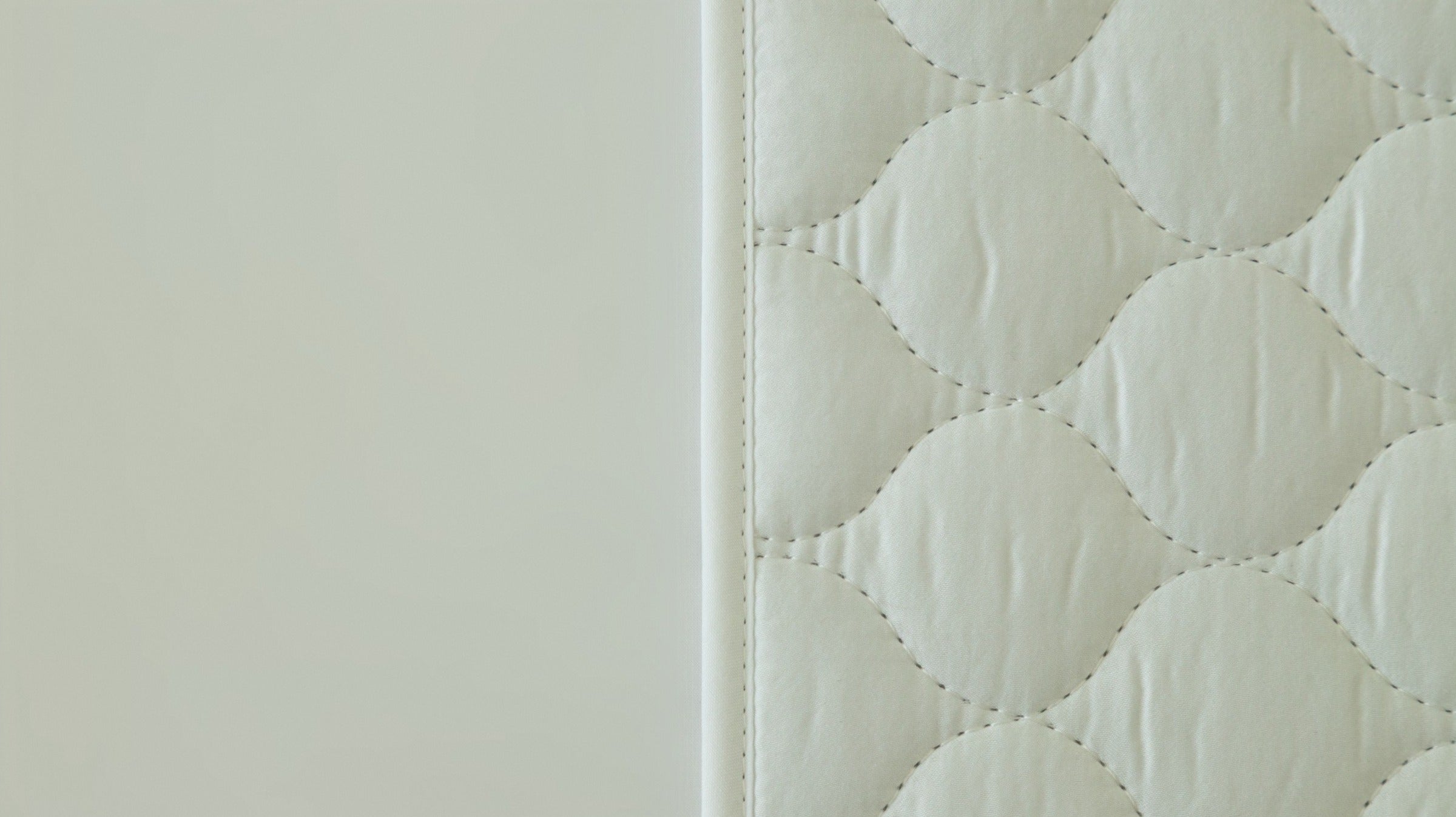 Close-up of a quilted Bedwetz mattress protector